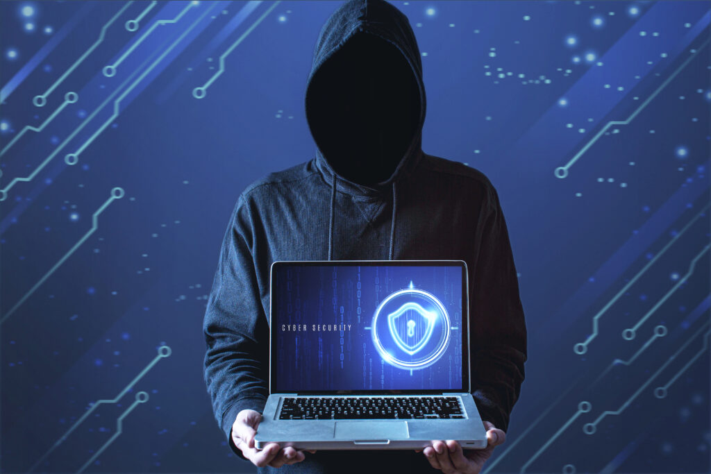 medium-shot-man-with-hoodie-holding-laptop - OSVPN Blog – VPN News, Security Tips & Hosting Updates vpn service